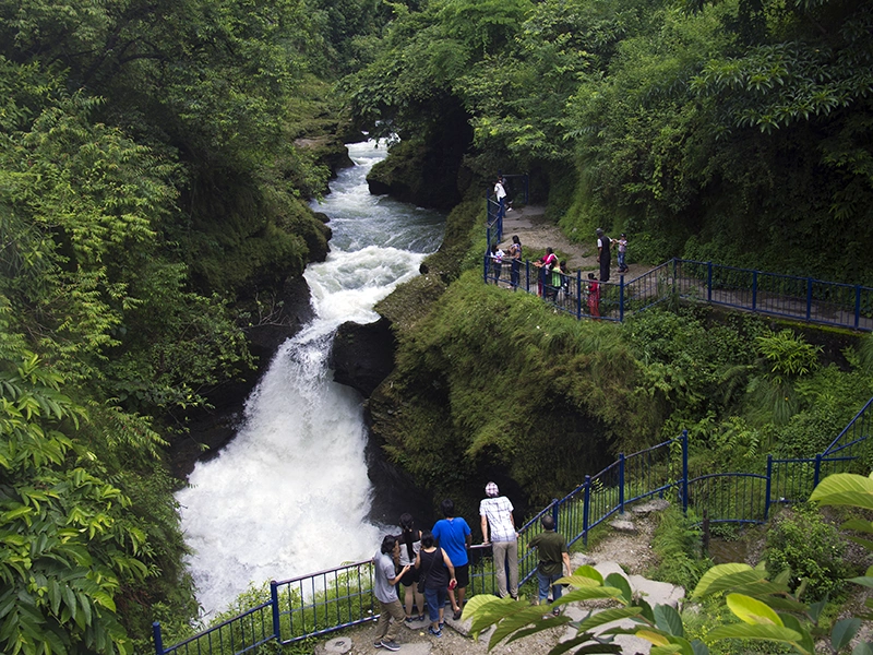 visitors on David's Fall on monsoon on pokhara